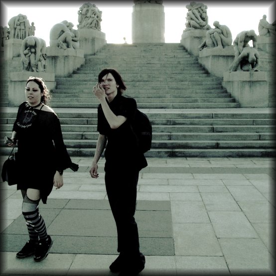 A couple passing in front of my camera as I was shooting details of the Monolith terrace in the Vigeland Sculpture Park.