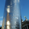 Spire of Dublin. The Spire of Dublin is a large, pin-like monument, 120 metres (393 ft) in height and lit from the top, whose erection was completed on January 21, 2003 on the site of the former Nelson Pillar on O'Connell Street in the Irish capital, Dublin. (words taken from the wikipedia entry)