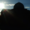 Facing the sun and a church, turned black.
