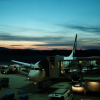 It's two minutes after midnight. I'm at OSL airport. The sky still bears the colours of twilight. My flight is delayed for another hour. I look at the plane I'll take. It will bring me back home, where the night is black and where I can see more than 6 stars in the middle of the night. This is the end of this enjoyable vacation. In the morrow, I'll be back at work.
