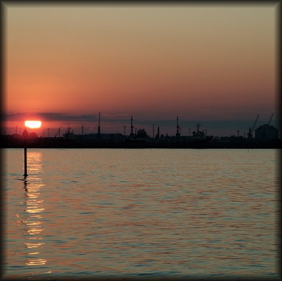 The sun is setting just as the boat arrives in Tallinn.