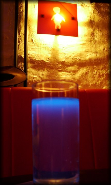 Black light provides an interesting hue at the top of this beverage