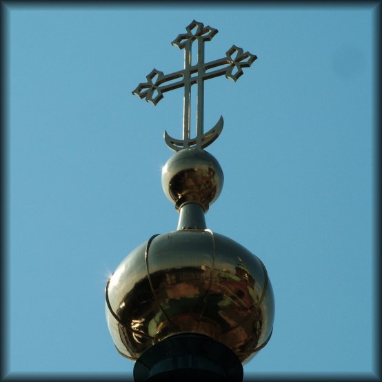 At the very top of the Uspenski Orthodox cathedral, a cross.