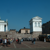A crowd of soldiers and tourists in front of the Helsinki Cathedral.