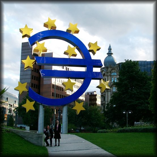 A couple in odd postures near the European Central Bank in Frankfurt am Main, Germany