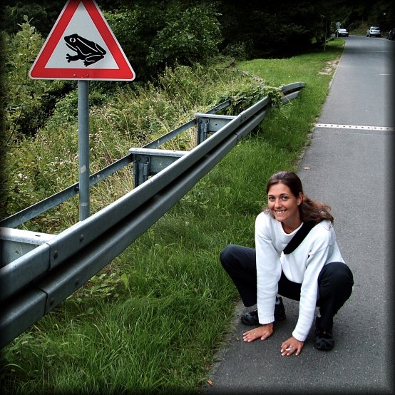 Me pausing as a frog, next to the beware of the frog sign, Eltville am Rhein, Germany