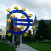 A couple in odd postures near the European Central Bank in Frankfurt am Main, Germany