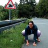 Bellie pausing as a frog, next to the beware of the frog sign, Eltville am Rhein, Germany