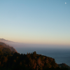 At dusk, from the terrace of the Nepenthe Caf\216, the moon reveals itself. 