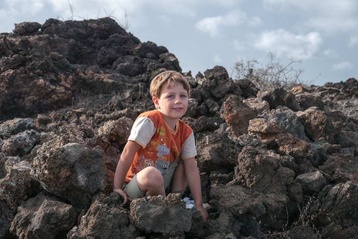 Squatting in the rocks